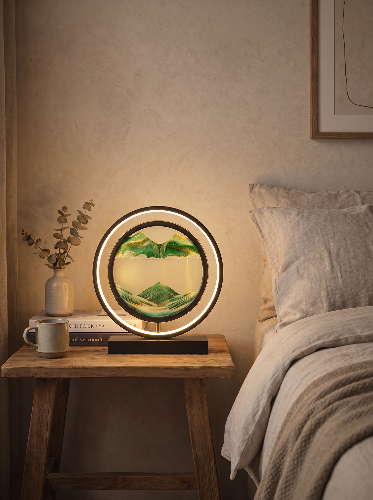 Sandlight Quicksand LED Table Lamp glowing softly on a bedside table