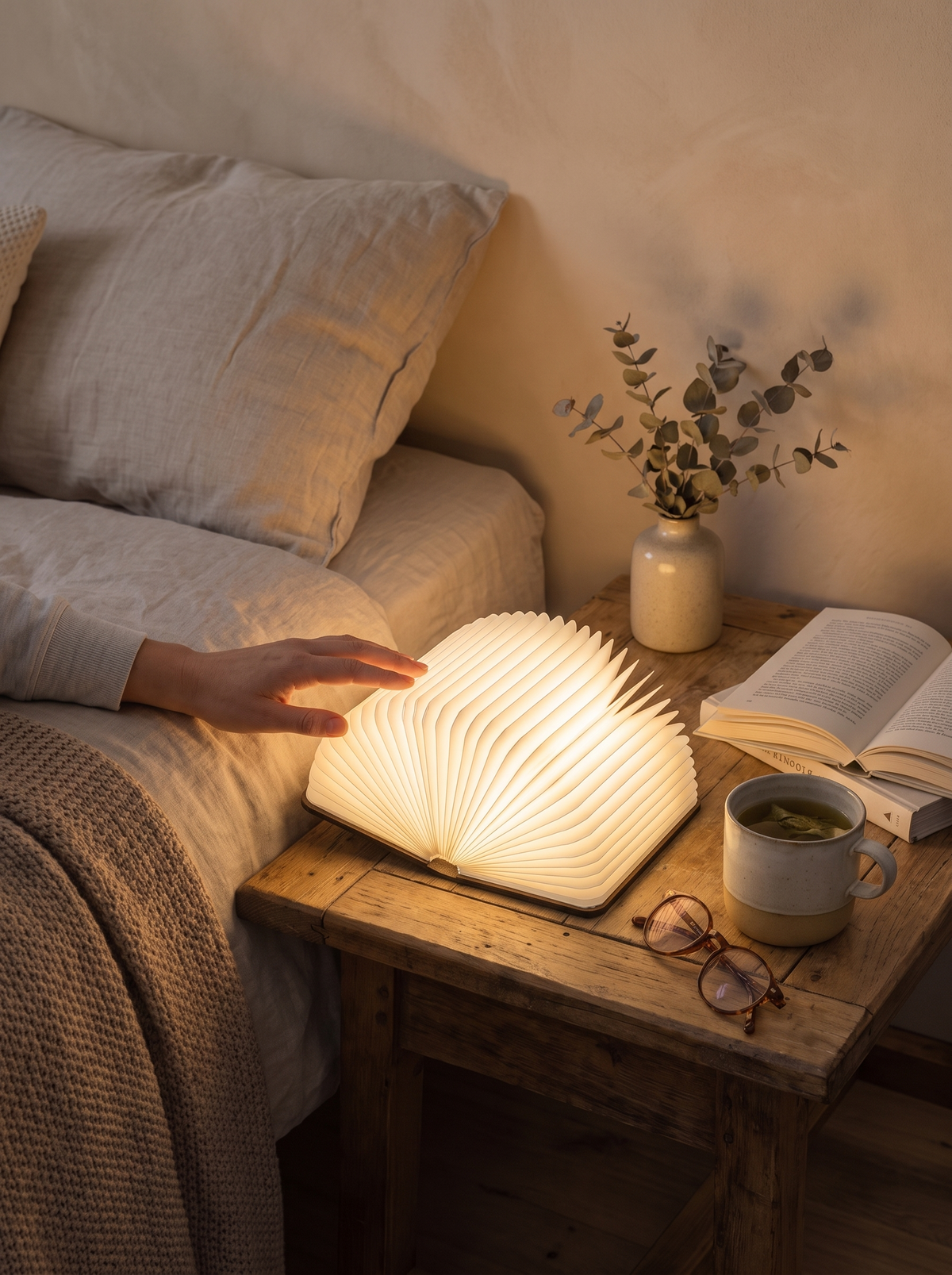 Lumibook Table Lamp folded on a bookshelf
