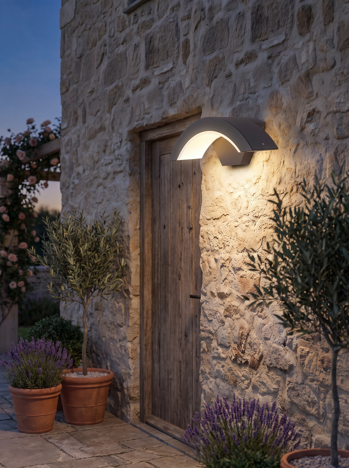 Modern Outdoor Wall Light lighting an exterior wall at dusk